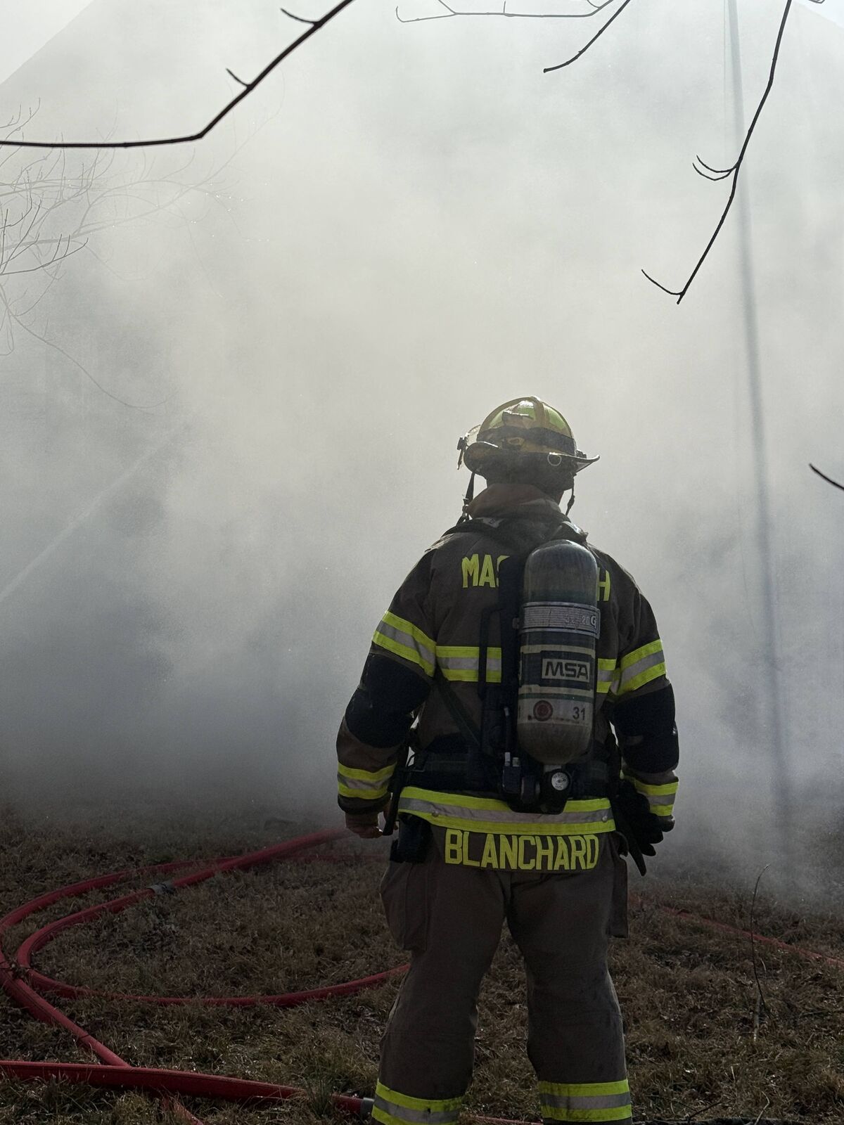 Lt. Blanchard standing ready on scene in heavy smoke